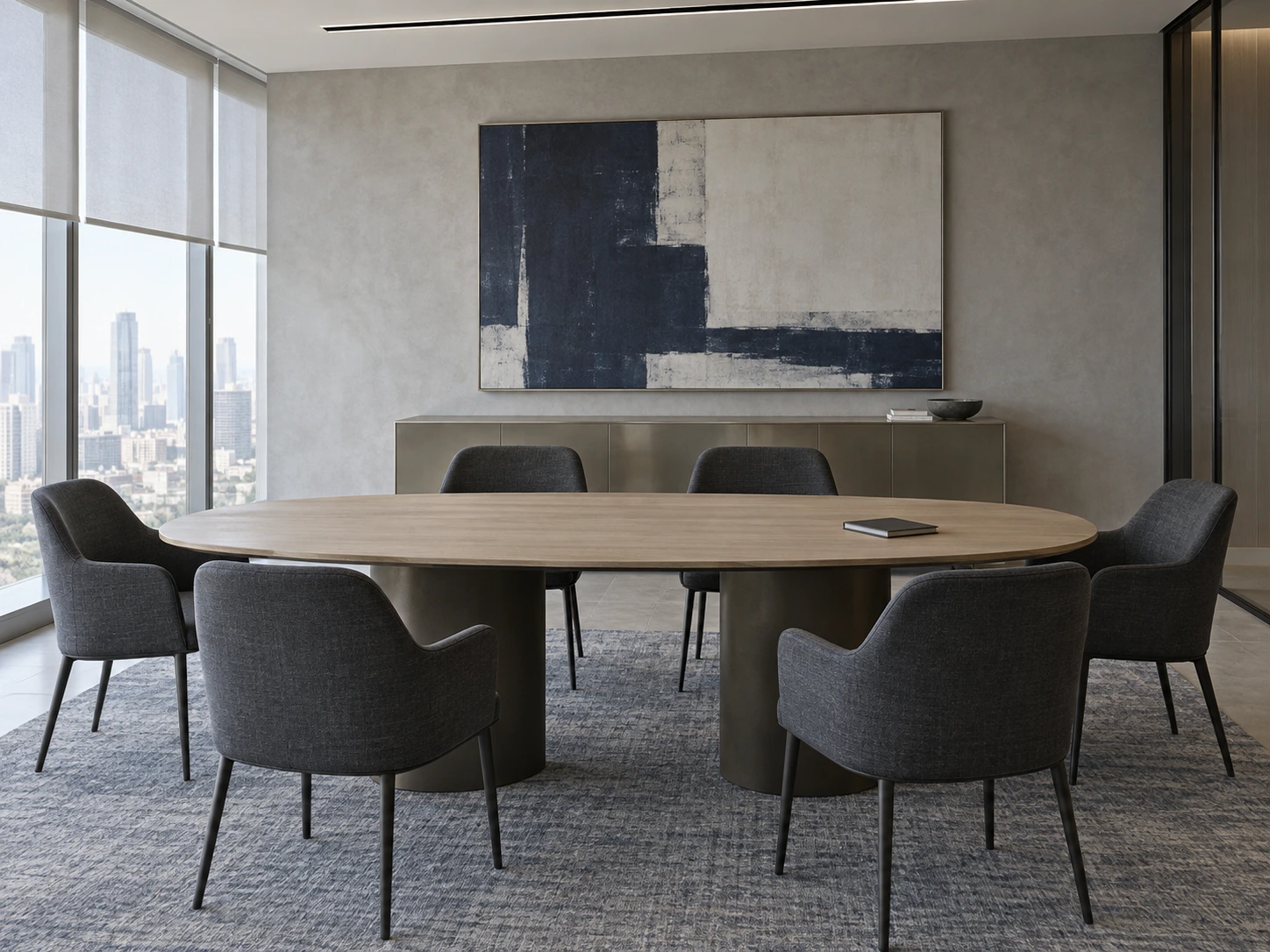 Meeting room with an oval table and charcoal upholstered chairs